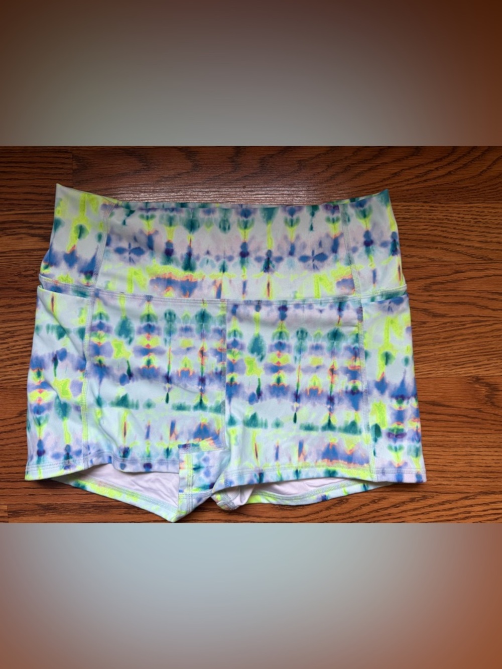 Fabletics Tie-Dye High-Waist Athletic Bike Shorts in Neon Yellow, Blue, Green